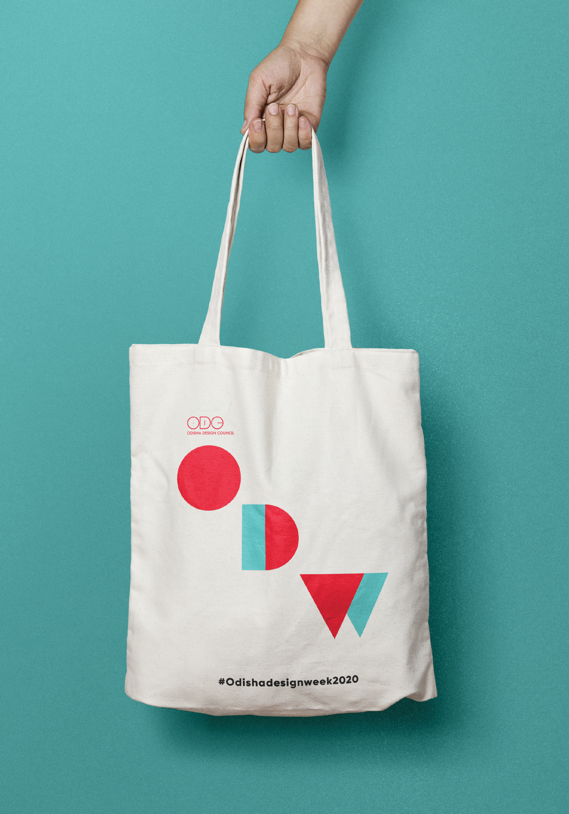 Extended brand applications: merchandise, badges, and printed materials.